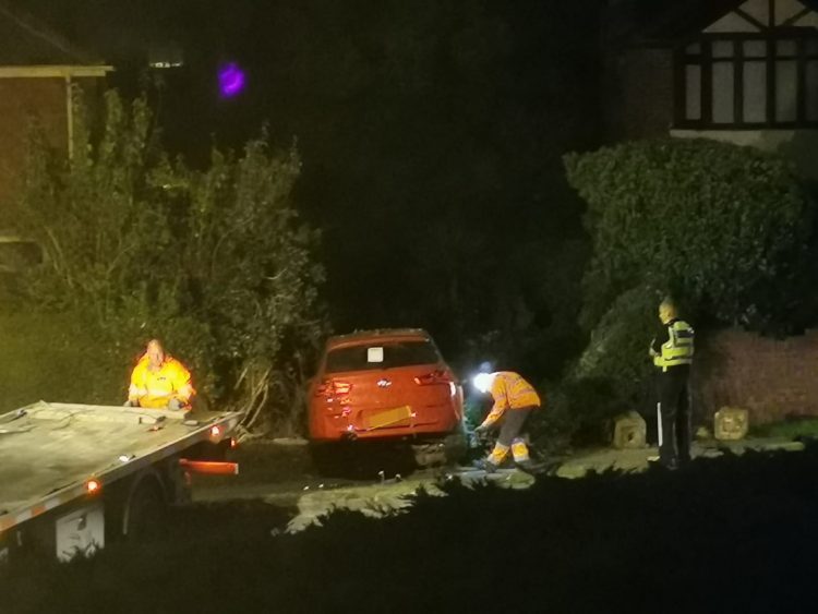 Police investigate after car ploughs through garden wall in Swindon