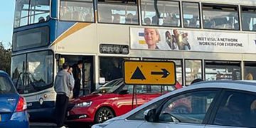 Traffic chaos as bus and car collide on busy Swindon roundabout