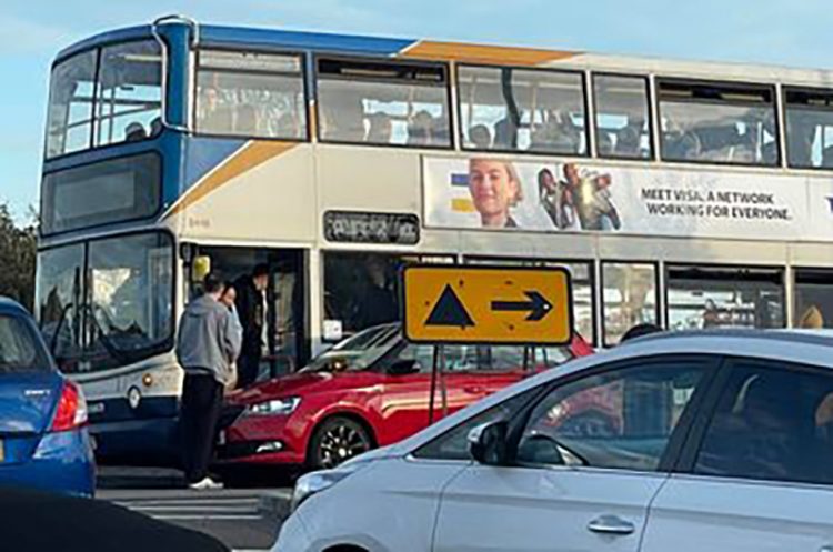 Traffic chaos as bus and car collide on busy Swindon roundabout