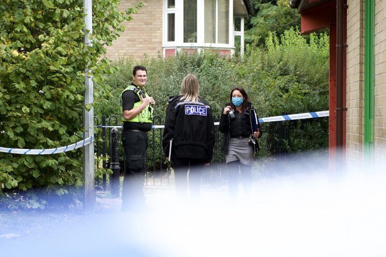 Detectives investigate gun discovery — crime scene outside dental practice