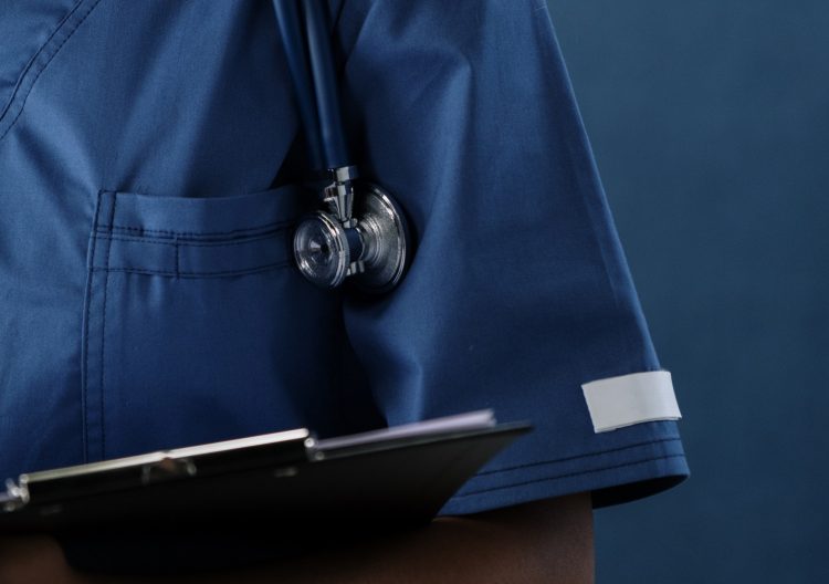 Woman in hospital scrubs tried to sell doorstep coronavirus tests for £60