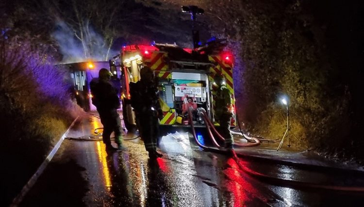 Bus blaze sees A3102 closed in both directions whilst firefighters tackle flames