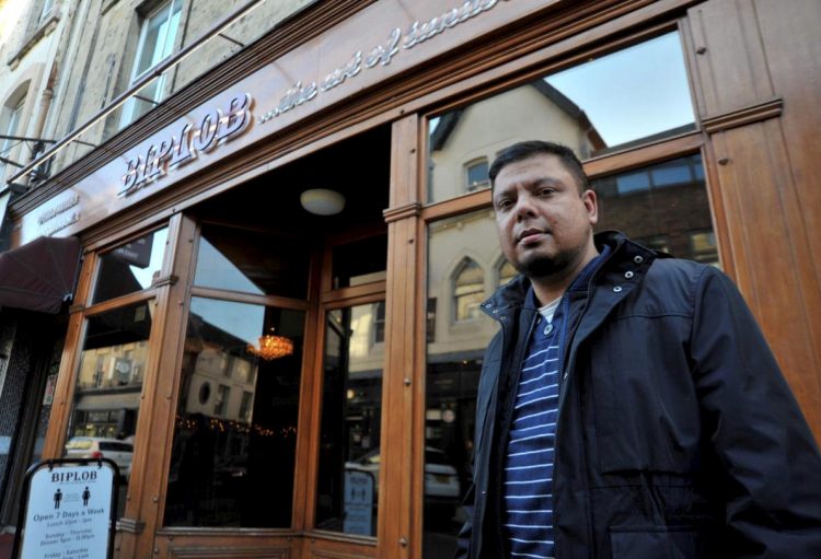 Police hunt racist thugs who targeted Indian restaurant whilst customer ate inside