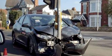 Traffic light remains upright after being wiped out by car and dragged 50 metres