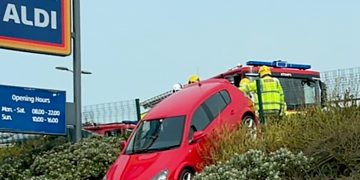 Aldi do that? Driver crashes out of supermarket car park – stopping on a steep hill