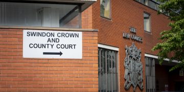 Swindon man in court accused of causing two police officers serious injuries