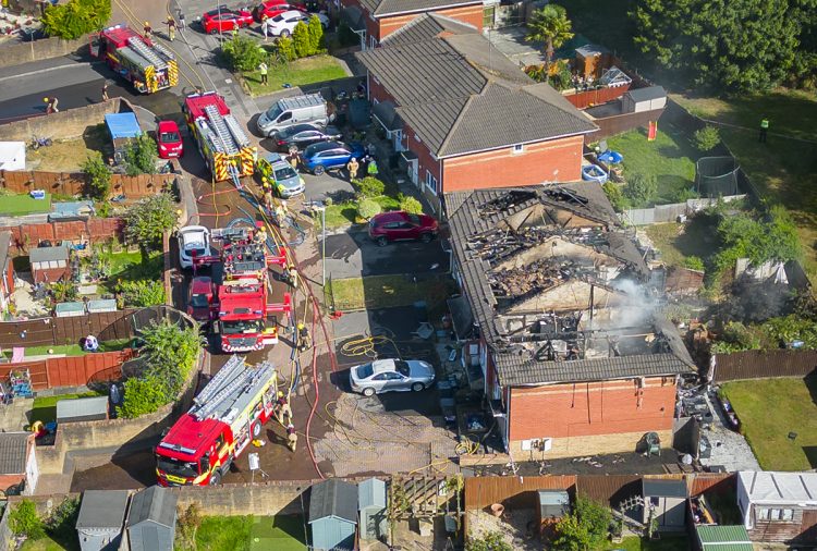 Huge blaze that ripped through four houses caused by ‘discarded cigarette’ in garden