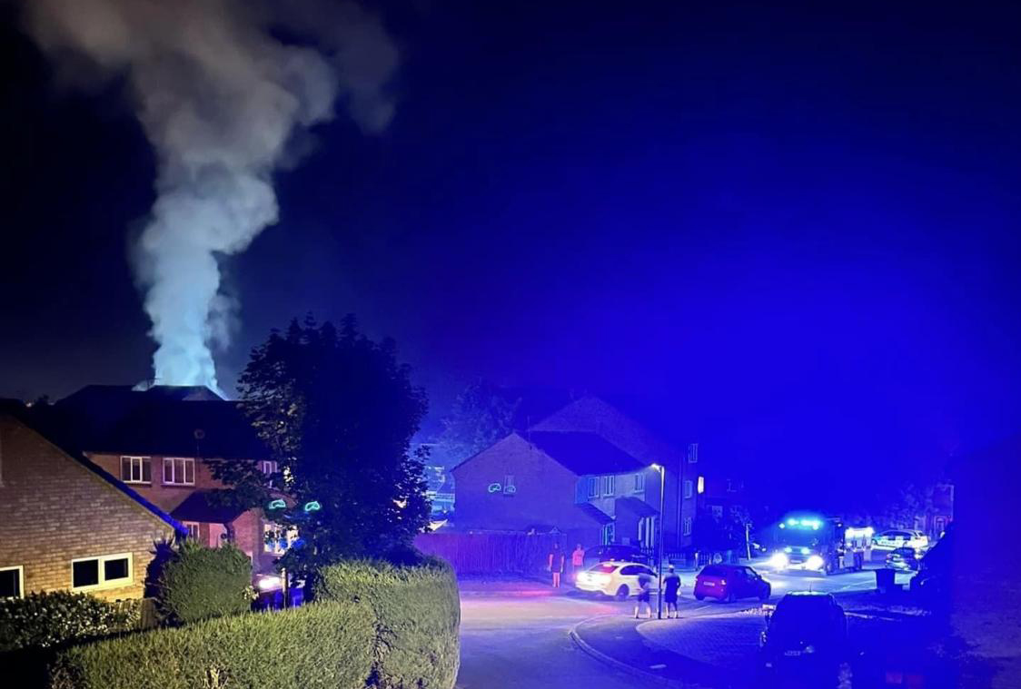 Four fire crews tackle flames at flats in Swindon as smoke billows