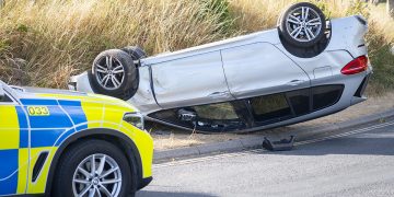 Car flips onto roof in crash on Wiltshire road as emergency services rush to scene