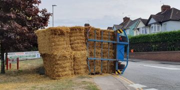 Traffic chaos in Royal Wootton Bassett as trailer transporting straw overturns