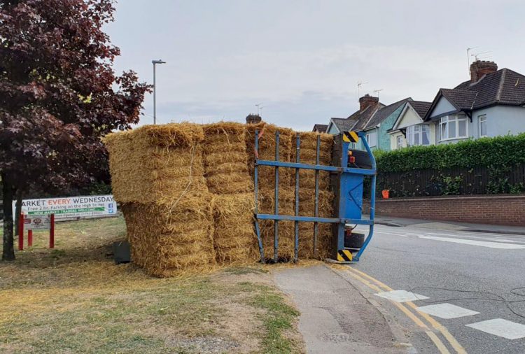 Traffic chaos in Royal Wootton Bassett as trailer transporting straw overturns