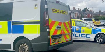 Swindon street locked down as armed police officers swoop on property