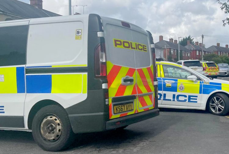 Swindon street locked down as armed police officers swoop on property