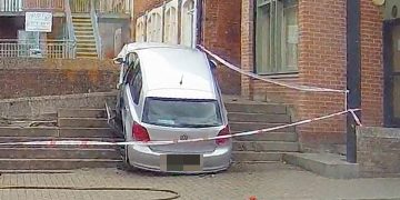 Driver baffles witnesses by crashing car up steps in mishap whilst leaving supermarket