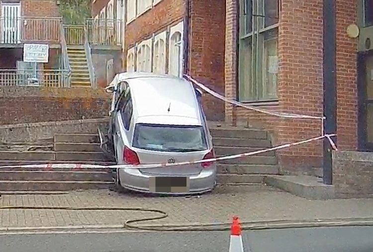Driver baffles witnesses by crashing car up steps in mishap whilst leaving supermarket