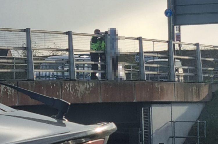 Police officers rush to A419 bridge and cling onto ‘distressed’ man’s clothing