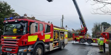Firefighters tackle flames coming from chimney at house in Calne