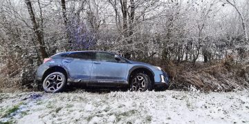 Driver loses control of car on snowy road and crashes into ditch in Ashton Keynes