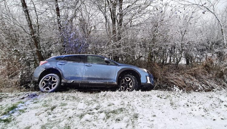 Driver loses control of car on snowy road and crashes into ditch in Ashton Keynes
