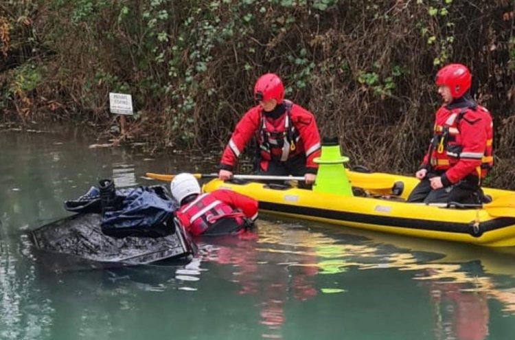 Emergency services mount rescue operation after car plunges into icy canal