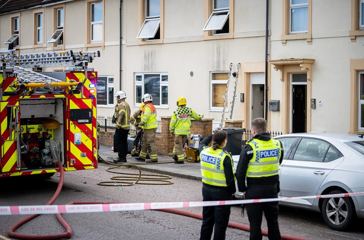 Firefighters tackle blaze at Swindon B&B as police close central route