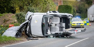 Two casualties trapped in overturned car after driver loses control on A345