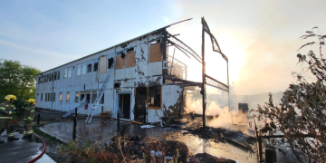 Tisbury blaze spreads to train line as firefighters tackle flames