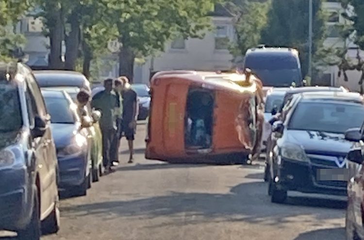 Car overturns in dramatic crash on residential road in Swindon