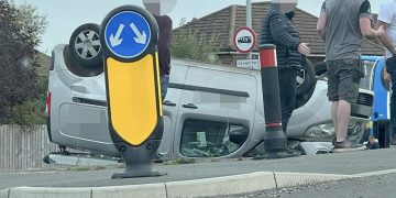Van overturns in dramatic crash on roundabout outside Swindon pub