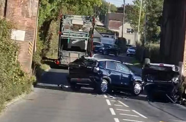 Car transporter lorry sheds load in Trowbridge railway bridge crash