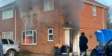 Firefighters battle blaze at Swindon house as road partially blocked
