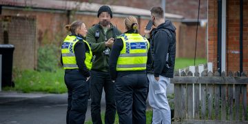 Police swoop on Swindon street as ambulance crews attend property