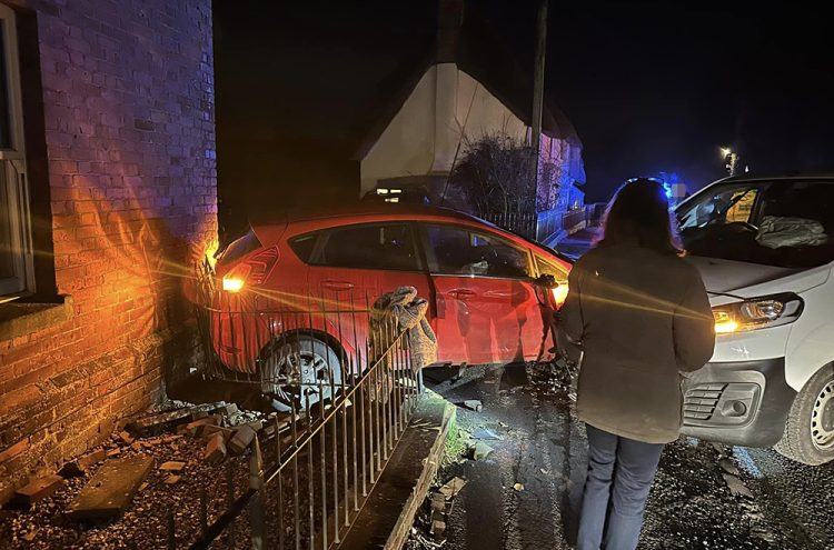Woman in hospital after car collides with house in Wiltshire village