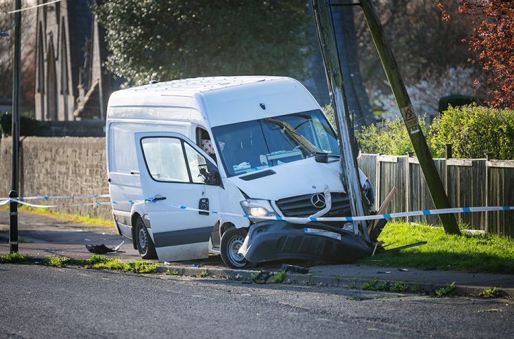 Road closure and power cut as van smashes into telegraph pole