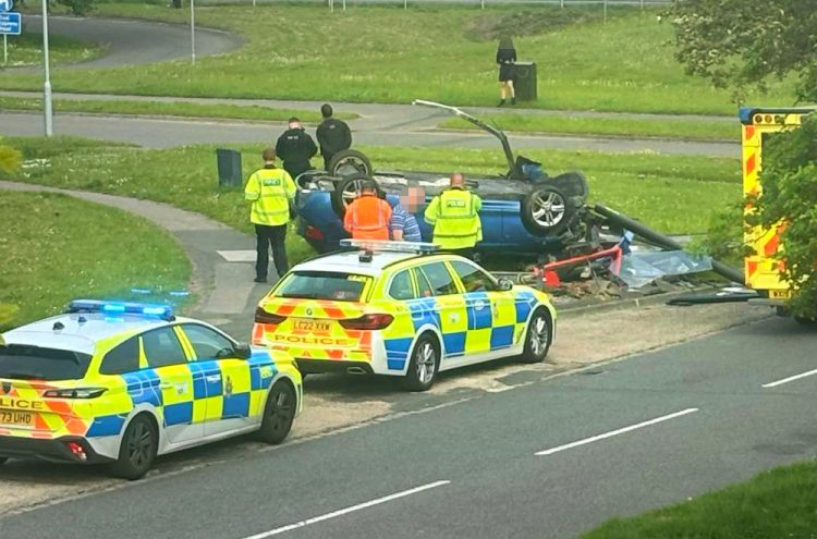 Manhunt in Swindon after car overturns and destroys bus shelter