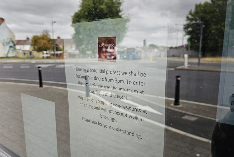 Businesses in Swindon close as armed police patrol over riot risk