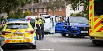 Car flips in dramatic Swindon crash as driver ‘hides in wheelie bin’