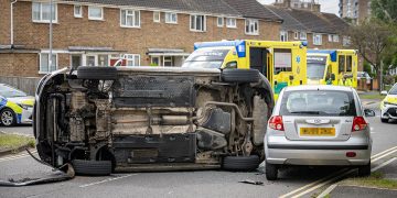 Car flips in dramatic Swindon crash as driver ‘hides in wheelie bin’