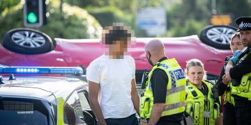 Driver arrested after car overturns in dramatic Swindon smash