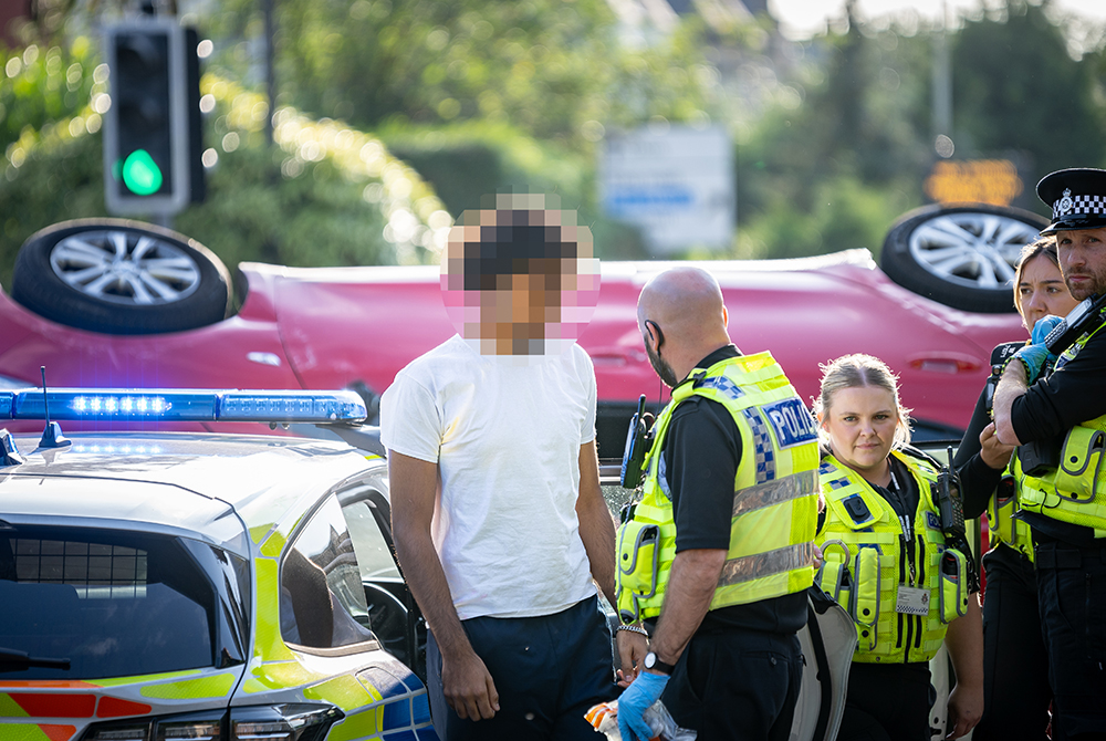 Driver arrested after car overturns in dramatic Swindon smash