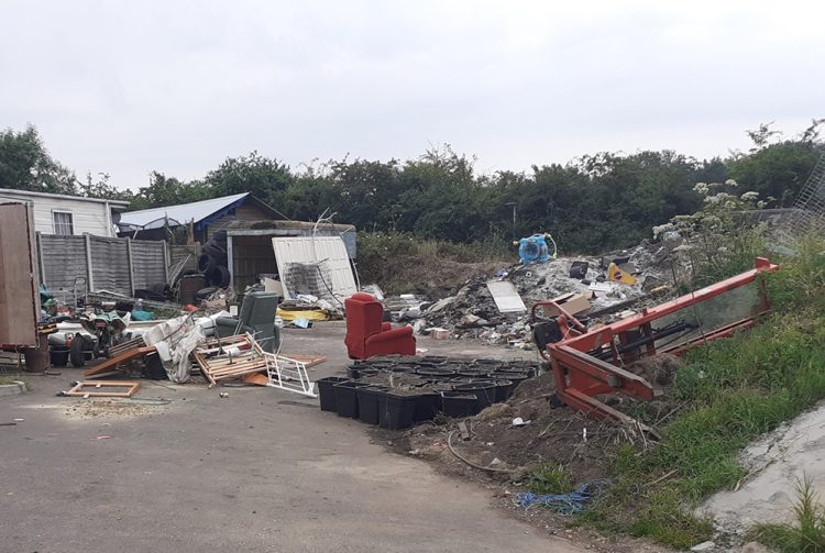 Family evicted from caravan site after burning toxic waste