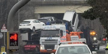 Car transporter hits Swindon bridge as road closed by police