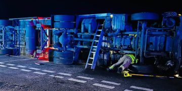 Car occupants narrowly escape death after lorry overturns
