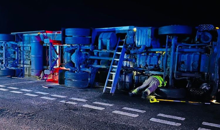 Car occupants narrowly escape death after lorry overturns