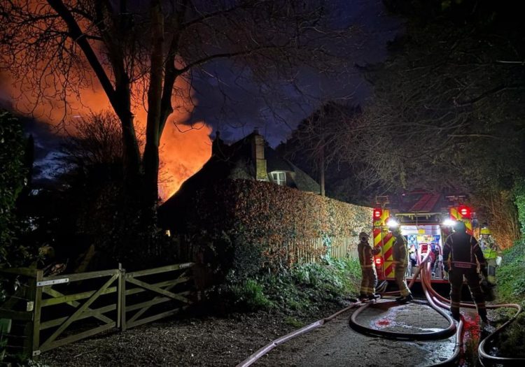 50 firefighters tackle thatched cottage blaze on Wiltshire border