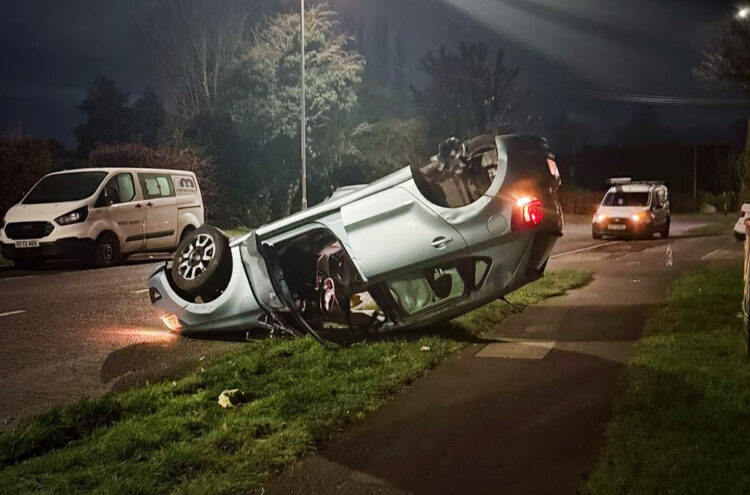 Driver hospitalised after flipping car onto roof in Swindon street