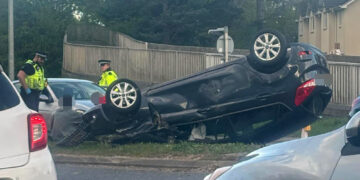 Major road in Swindon partially blocked after car flips onto roof