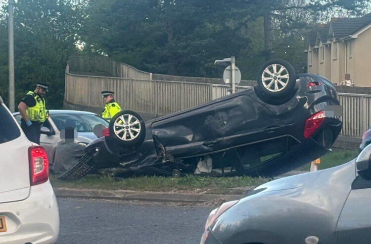 Major road in Swindon partially blocked after car flips onto roof