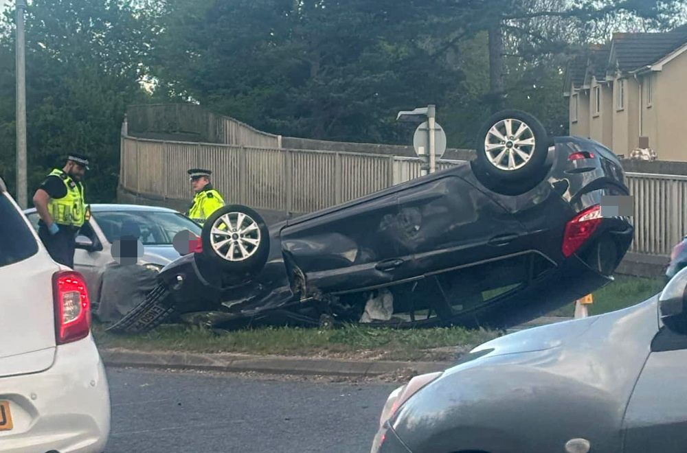 Major road in Swindon partially blocked after car flips onto roof