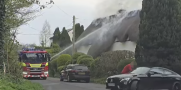 Wiltshire road closed as firefighters battle thatched cottage blaze